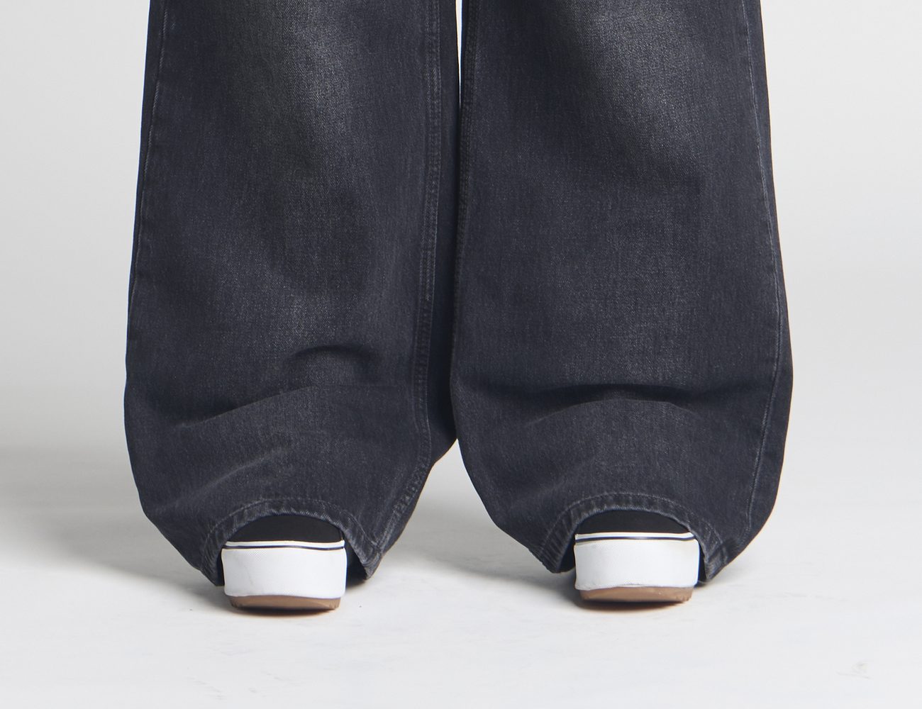 Heavy denim stacking over the shoe